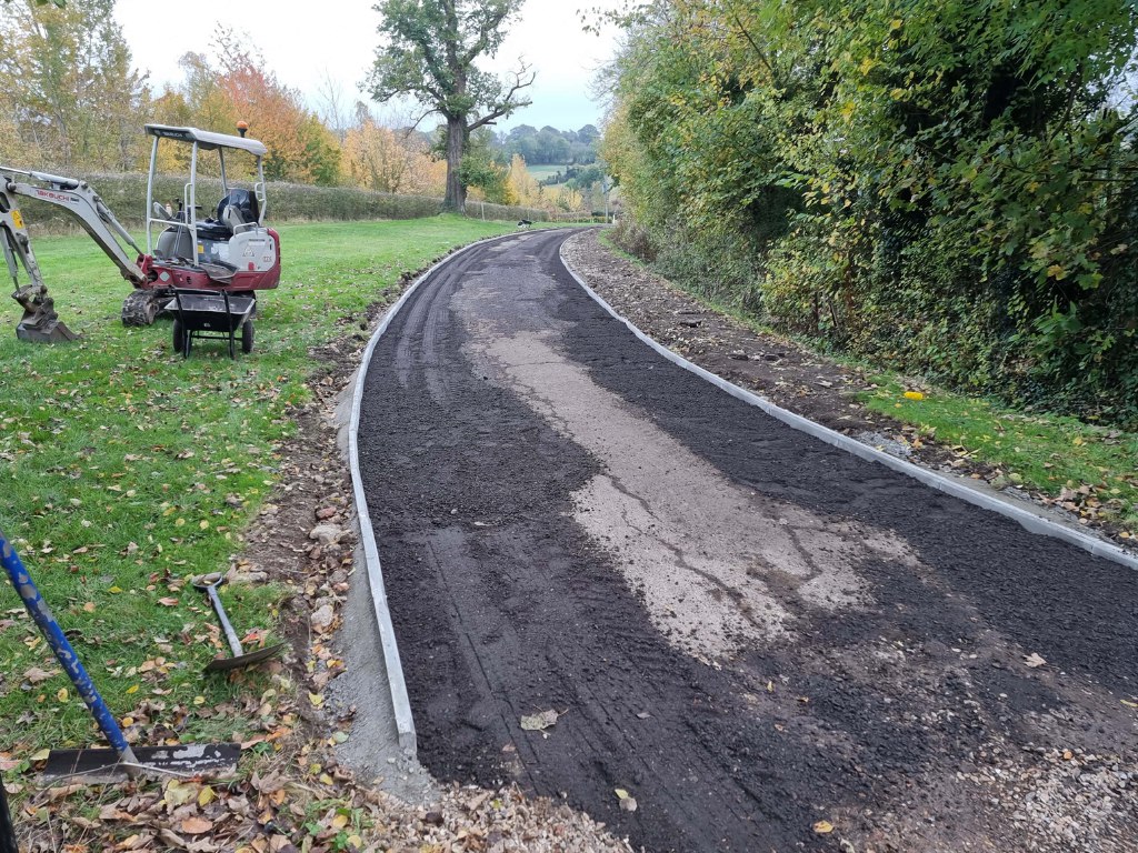 This is a large driveway which is in the process of having a tar and chip driveway installed on by NS Driveways Chertsey